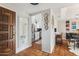 View of the entryway featuring a wood door, tile flooring and access to the kitchen at 3059 E Rose Ln, Phoenix, AZ 85016