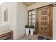 Front door with wood detail and planters at 3059 E Rose Ln, Phoenix, AZ 85016