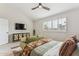 Bright main bedroom featuring a ceiling fan and plenty of natural light at 3059 E Rose Ln, Phoenix, AZ 85016