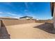 Empty backyard featuring perimeter block wall providing privacy and clear space at 11950 W Parkway Ln, Avondale, AZ 85323