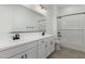 A bathroom featuring a double vanity and a shower/tub combination at 11950 W Parkway Ln, Avondale, AZ 85323