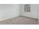 A bright bedroom with neutral carpeting and a sun-drenched window at 11950 W Parkway Ln, Avondale, AZ 85323