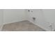 Spacious laundry room featuring tile flooring and convenient hookups at 11950 W Parkway Ln, Avondale, AZ 85323