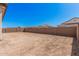Large, private backyard enclosed with block fencing, offering privacy and room to roam at 12007 W Parkway Ln, Avondale, AZ 85323