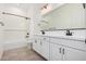 A modern bathroom with double vanity, sleek fixtures, and a shower-tub combo at 12007 W Parkway Ln, Avondale, AZ 85323
