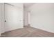 A well-lit bedroom includes closet and doorway access at 12007 W Parkway Ln, Avondale, AZ 85323