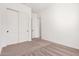 A well-lit bedroom includes closet and doorway access at 12007 W Parkway Ln, Avondale, AZ 85323