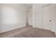 A well-lit bedroom includes closet and doorway access at 12007 W Parkway Ln, Avondale, AZ 85323