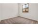 An inviting bedroom offers plush carpeting and a window for natural light at 12007 W Parkway Ln, Avondale, AZ 85323