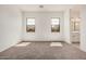 This bedroom has plush carpet and two windows offering great natural light at 12007 W Parkway Ln, Avondale, AZ 85323