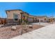Charming single-story home featuring a neutral color scheme, manicured landscaping, and a welcoming two-car garage at 12007 W Parkway Ln, Avondale, AZ 85323