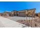 Desirable front exterior showcases a three-car garage and brick paver driveway at 12007 W Parkway Ln, Avondale, AZ 85323