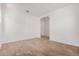 A well-lit living room features tile flooring and an open layout at 12007 W Parkway Ln, Avondale, AZ 85323