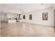 Bright, open-concept living space with tile flooring and abundant natural light at 12007 W Parkway Ln, Avondale, AZ 85323