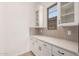 Spacious walk-in pantry with ample shelving, providing plenty of storage at 12007 W Parkway Ln, Avondale, AZ 85323