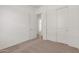 Bedroom featuring carpet, closet with sliding doors, and neutral walls at 12012 W Parkway Ln, Avondale, AZ 85323