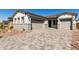 Charming single-story home with a three-car garage and a paved driveway at 12012 W Parkway Ln, Avondale, AZ 85323