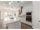 Kitchen with a large island, stainless steel appliances, and white cabinets offering a modern aesthetic at 12012 W Parkway Ln, Avondale, AZ 85323