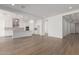 Open living space highlighting light wood flooring, modern lighting, and seamless flow between rooms at 12012 W Parkway Ln, Avondale, AZ 85323