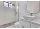 Modern bathroom with white vanity, vessel sink, walk-in shower and decorative tiling at 32278 N 168Th Ave, Surprise, AZ 85387