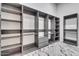 Spacious walk-in closet offers custom shelving and storage solutions for optimal organization at 32278 N 168Th Ave, Surprise, AZ 85387