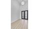 Entryway with high ceilings, wood-look flooring, contemporary light fixture, and double front doors at 32278 N 168Th Ave, Surprise, AZ 85387