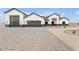 Stunning modern home with a large garage and a beautifully paved driveway and desert landscape at 32278 N 168Th Ave, Surprise, AZ 85387