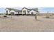 Exterior showcasing the desert landscaping, neutral paint and attached garages with black trim at 32278 N 168Th Ave, Surprise, AZ 85387