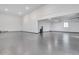 Large garage with finished floor, lighting, window and storage capabilities at 32278 N 168Th Ave, Surprise, AZ 85387