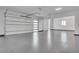Spacious three-car garage with white walls, ample lighting, and epoxy flooring at 32278 N 168Th Ave, Surprise, AZ 85387