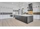 Gourmet kitchen with stainless steel appliances, a large island, and modern backsplash design at 32278 N 168Th Ave, Surprise, AZ 85387