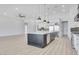 Well-designed kitchen with a large island, stainless steel appliances, and ample counter space at 32278 N 168Th Ave, Surprise, AZ 85387