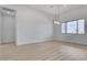 Open-concept living space with recessed lighting, desert views, and modern chandelier at 32278 N 168Th Ave, Surprise, AZ 85387