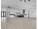 Expansive living area showcasing an open layout, modern kitchen, and a view of the desert landscape at 32278 N 168Th Ave, Surprise, AZ 85387