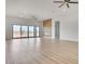 Bright and open living room with a modern fireplace, large windows, and sleek flooring at 32278 N 168Th Ave, Surprise, AZ 85387