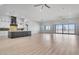 Open-concept living space featuring a modern kitchen, island, and large sliding glass doors with desert views at 32278 N 168Th Ave, Surprise, AZ 85387