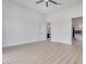 Bright main bedroom boasts light wood flooring and a view of the fireplace in the bathroom at 32278 N 168Th Ave, Surprise, AZ 85387