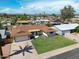 Aerial view of a single-Gathering home showcasing the roof, lawn, and mature trees at 2236 E Blanche Dr, Phoenix, AZ 85022