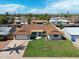 An aerial view of a well-maintained home with lush lawn, a large driveway and mature trees at 2236 E Blanche Dr, Phoenix, AZ 85022