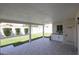 Covered back patio features a built-in grill, ample room for entertaining, and a green backyard at 2236 E Blanche Dr, Phoenix, AZ 85022