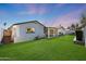 Spacious backyard with lush green grass and a covered patio, perfect for outdoor entertaining at 2236 E Blanche Dr, Phoenix, AZ 85022