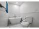 Bathroom featuring a sleek soaking tub and modern fixtures at 2236 E Blanche Dr, Phoenix, AZ 85022