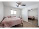 Bedroom features wood floors, natural lighting and mirrored closet at 2236 E Blanche Dr, Phoenix, AZ 85022