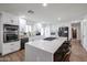 Bright kitchen featuring white cabinetry, a large center island, and stainless steel appliances at 2236 E Blanche Dr, Phoenix, AZ 85022