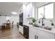 Kitchen with stainless steel appliances, white cabinets, and a breakfast bar at 2236 E Blanche Dr, Phoenix, AZ 85022