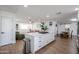 Bright kitchen with an island cooktop and open layout connecting the living and dining areas at 2236 E Blanche Dr, Phoenix, AZ 85022