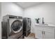 Convenient laundry room featuring modern washer and dryer at 2236 E Blanche Dr, Phoenix, AZ 85022
