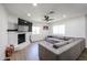 Spacious living area with a white-painted brick fireplace and a large sectional sofa at 2236 E Blanche Dr, Phoenix, AZ 85022