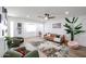 Bright living room featuring wood floors, modern decor, and a ceiling fan at 2236 E Blanche Dr, Phoenix, AZ 85022