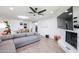 Open-concept room with a white brick fireplace, dining table, and view to entry way at 2236 E Blanche Dr, Phoenix, AZ 85022